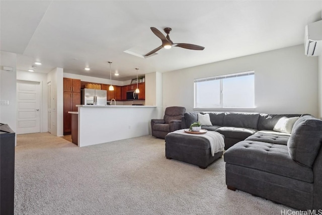 living room with ceiling fan, light colored carpet, and a wall unit AC