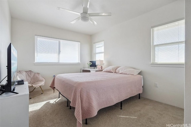 bedroom with light carpet and ceiling fan