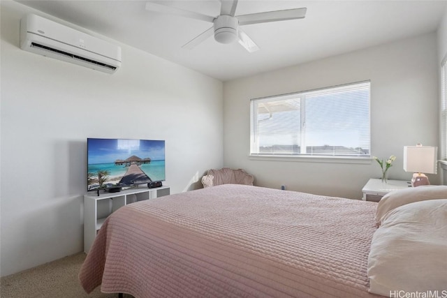 carpeted bedroom featuring a wall mounted AC and ceiling fan