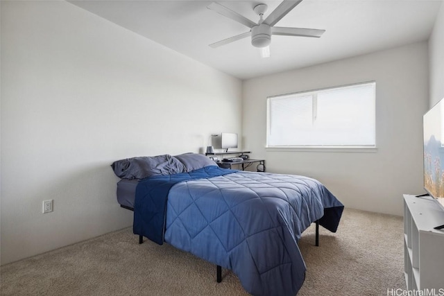 bedroom with ceiling fan and light carpet