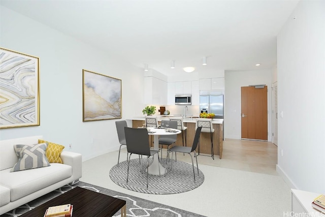 dining space featuring sink