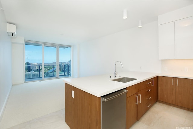 kitchen with stainless steel dishwasher, a sink, brown cabinetry, light countertops, and white cabinets