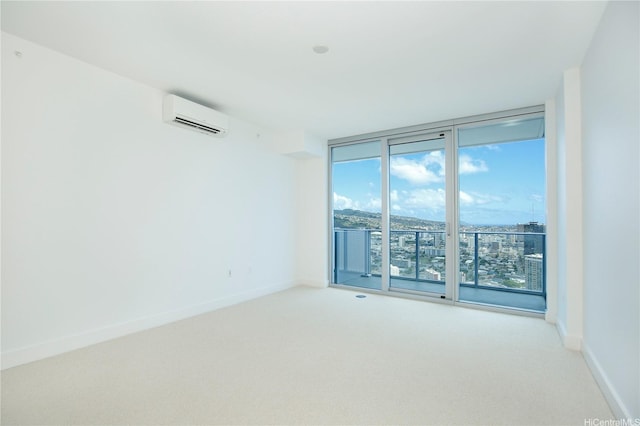 unfurnished room with floor to ceiling windows, a wall mounted air conditioner, baseboards, and light carpet