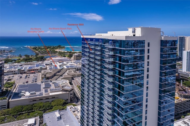 view of property with a water view and a view of city