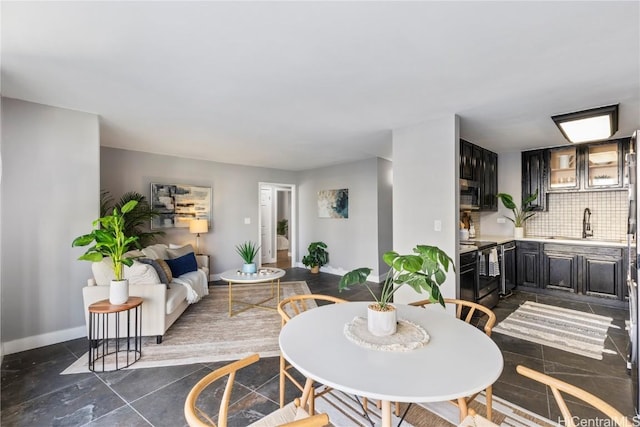 dining room with baseboards