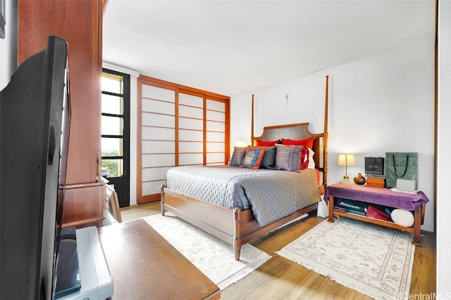 bedroom with light hardwood / wood-style floors