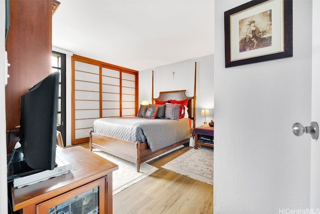 bedroom with light hardwood / wood-style floors