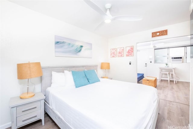 bedroom with hardwood / wood-style floors and ceiling fan