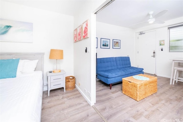 interior space with ceiling fan and light hardwood / wood-style flooring