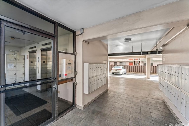 interior space featuring mail area and baseboards