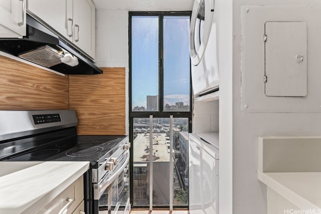 1415 Liholiho St Unit 909, Honolulu, HI 96822 - kitchen with electric stove, ventilation hood, electric panel, and a view of city