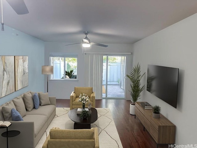 living room featuring hardwood / wood-style flooring and ceiling fan