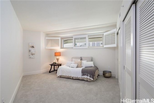 carpeted bedroom with a closet