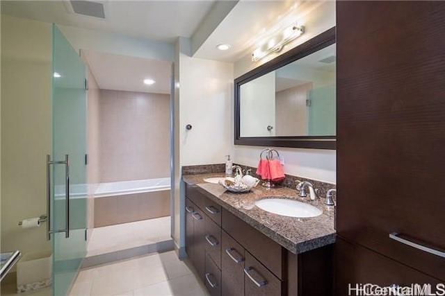 bathroom featuring shower with separate bathtub and vanity