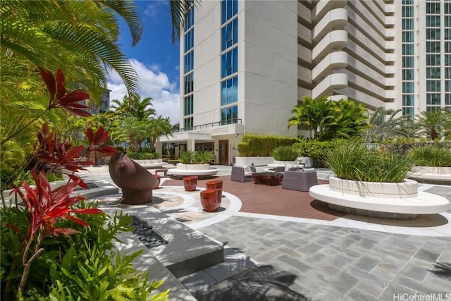 view of home's community with an outdoor hangout area and a patio