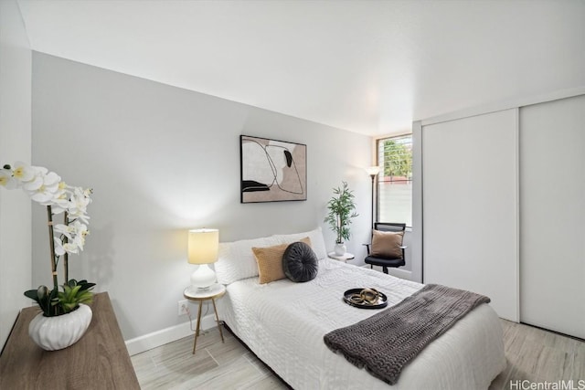 bedroom with a closet and light wood-type flooring