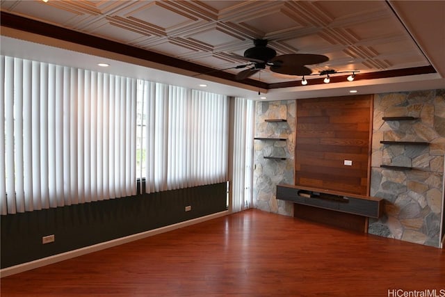 unfurnished living room with hardwood / wood-style flooring and ceiling fan