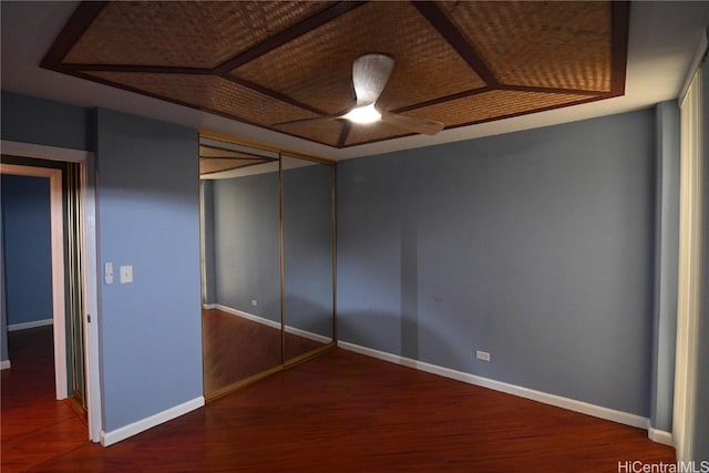 unfurnished bedroom featuring wood-type flooring and a closet