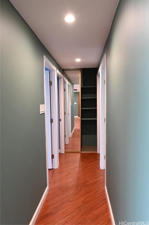 corridor featuring hardwood / wood-style flooring