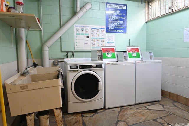 laundry area with sink and washer and clothes dryer