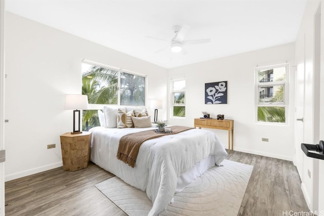 bedroom featuring wood-type flooring and ceiling fan