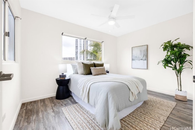 bedroom featuring wood-type flooring and ceiling fan