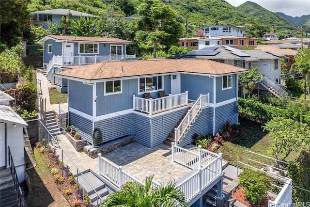 rear view of property featuring a mountain view