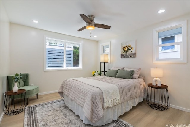 bedroom featuring light hardwood / wood-style flooring and ceiling fan