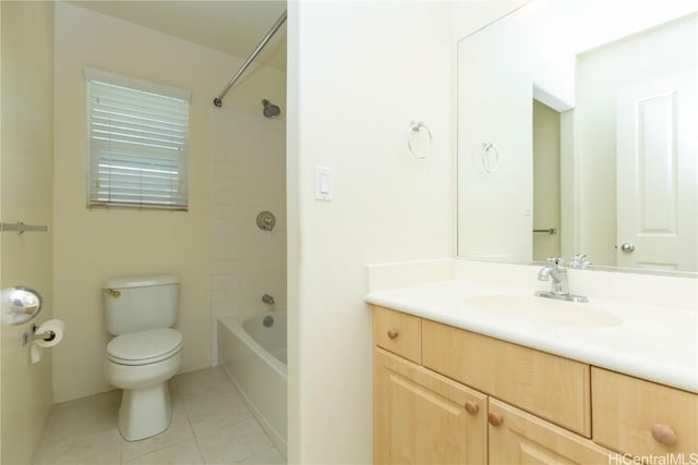 bathroom featuring vanity, tile patterned floors, toilet, and washtub / shower combination