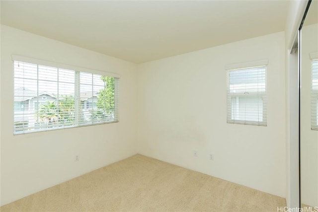 empty room featuring carpet flooring