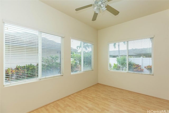 empty room featuring light wood-style floors and ceiling fan