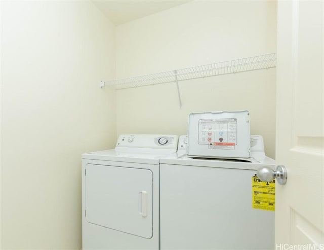 clothes washing area with laundry area and independent washer and dryer