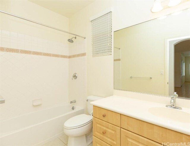 bathroom featuring bathtub / shower combination, toilet, vanity, and tile patterned flooring