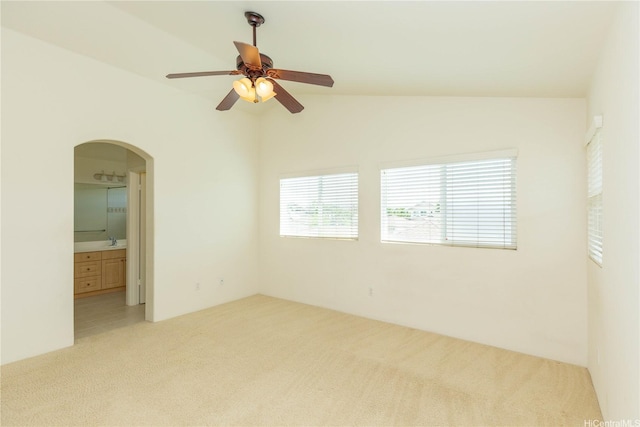 91-1137 Kai Kukuma St, Ewa Beach, HI 96706 - unfurnished room with light carpet, arched walkways, a ceiling fan, lofted ceiling, and a sink