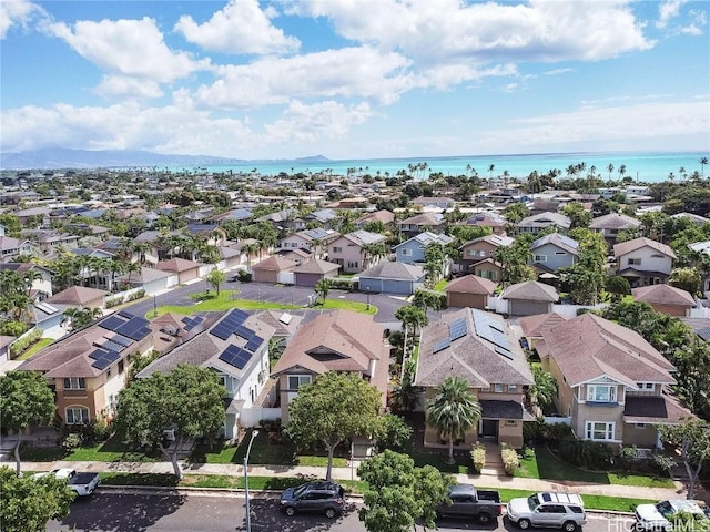 drone / aerial view featuring a residential view and a water view