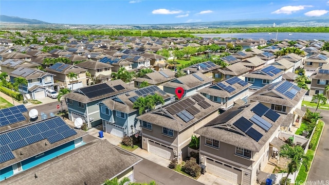 birds eye view of property with a mountain view and a residential view