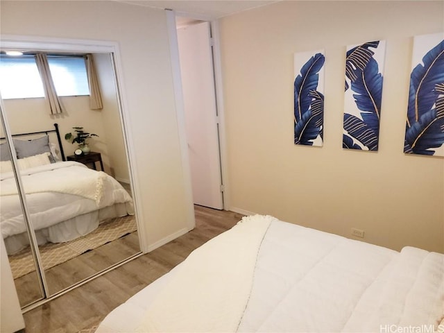 bedroom with wood-type flooring