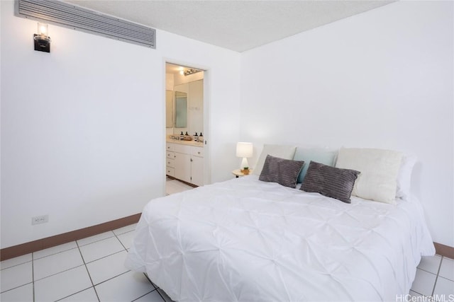 tiled bedroom with ensuite bath