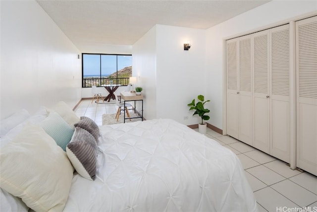 bedroom with light tile patterned flooring