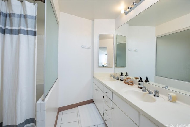 bathroom featuring walk in shower, tile patterned floors, and vanity