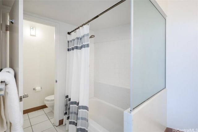 bathroom featuring shower / tub combo, tile patterned floors, and toilet