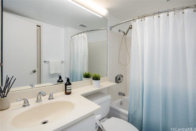 full bathroom with shower / bath combination with curtain, vanity, and toilet