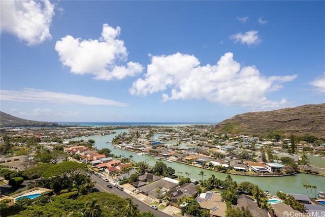 birds eye view of property featuring a water and mountain view