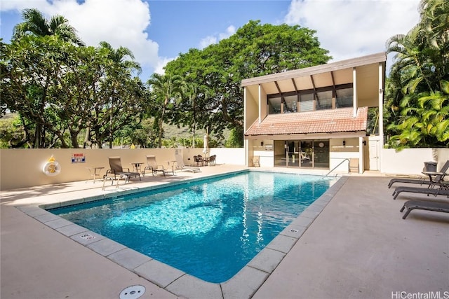 view of swimming pool with a patio area