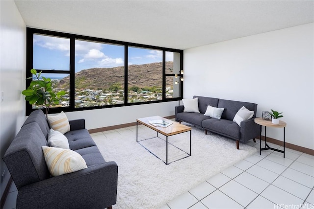 tiled living room with a mountain view