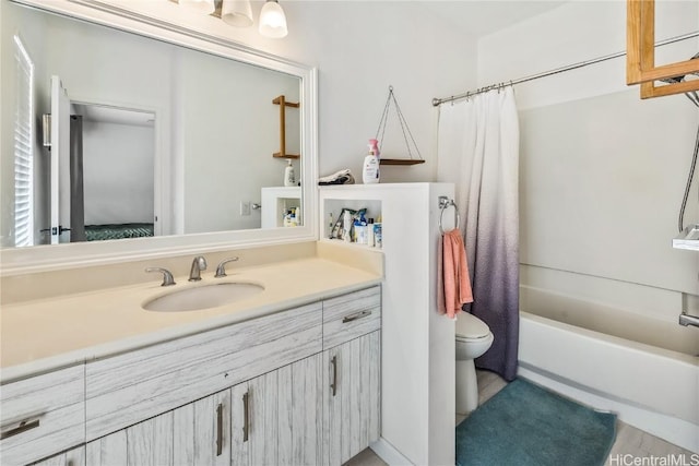 full bathroom featuring toilet, shower / tub combo with curtain, and vanity