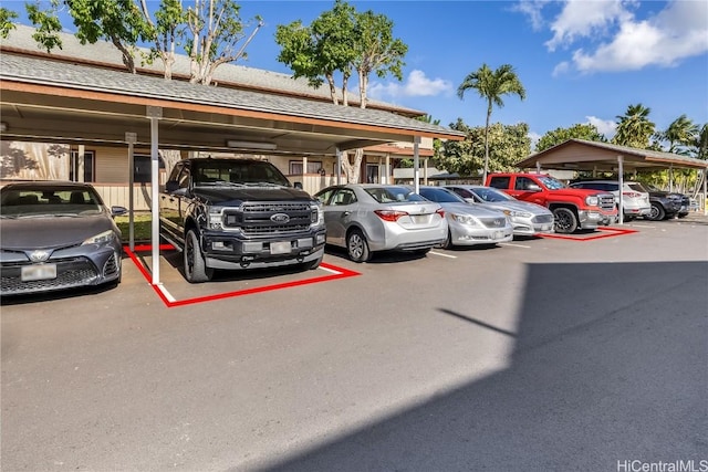 view of partially covered parking lot