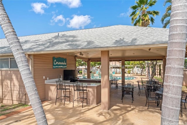 view of patio / terrace with a bar and a gazebo