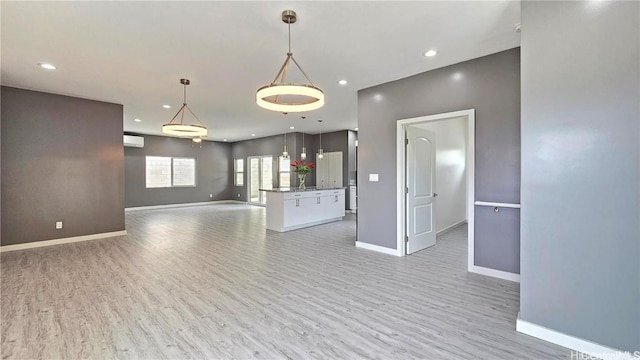 unfurnished living room featuring light hardwood / wood-style flooring