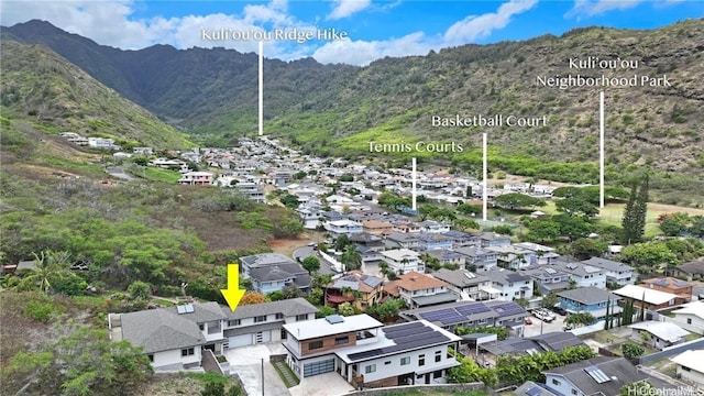 birds eye view of property with a mountain view